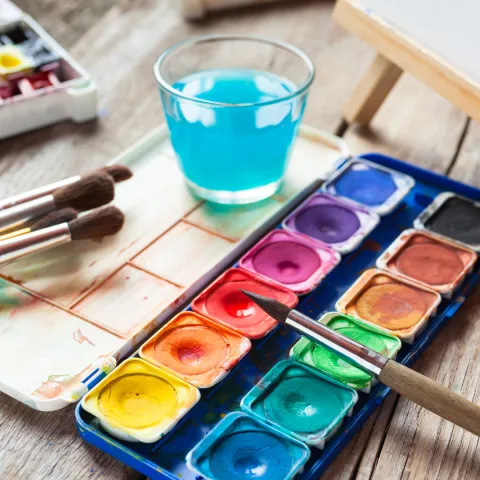 A small pallet of watercolor paints