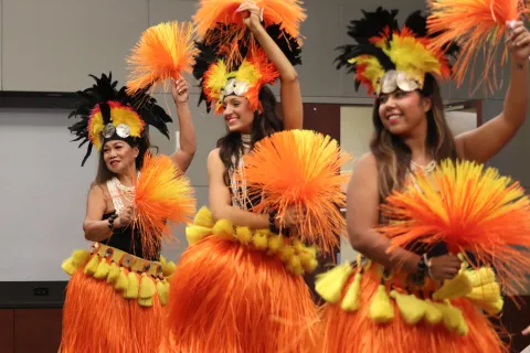 Three hula dancers from the Grace Hula Dance Co.
